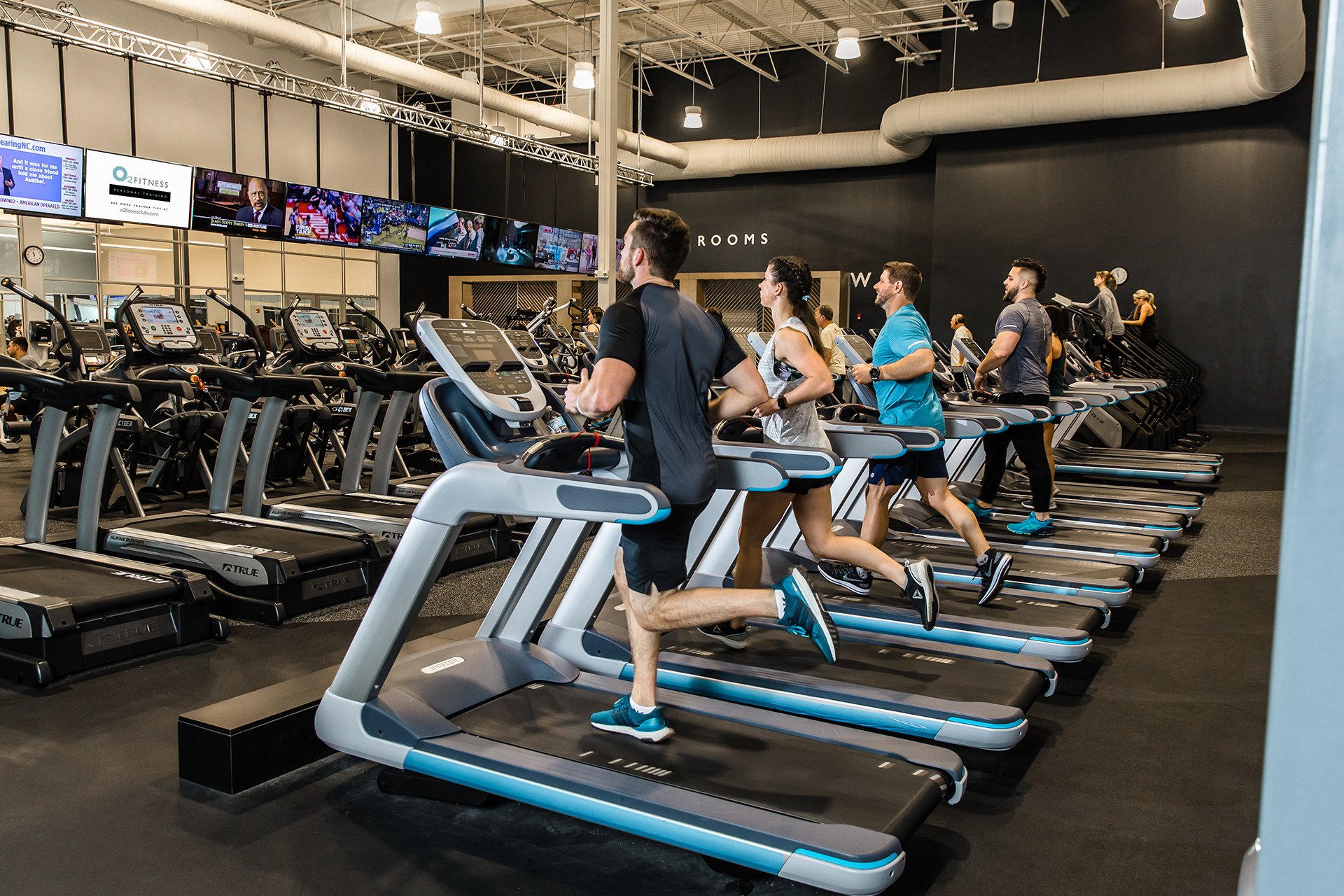 men and women running on treadmills at O2 Fitness Clubs 